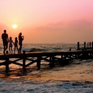 People Standing on Dock during Sunrise